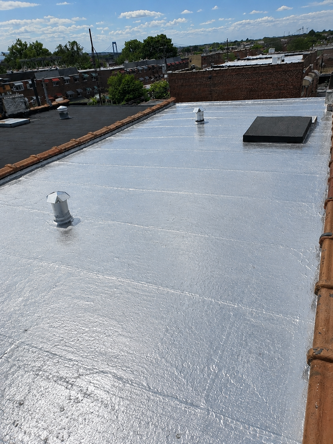 Flat roof repair work by Captain Construction Corp.