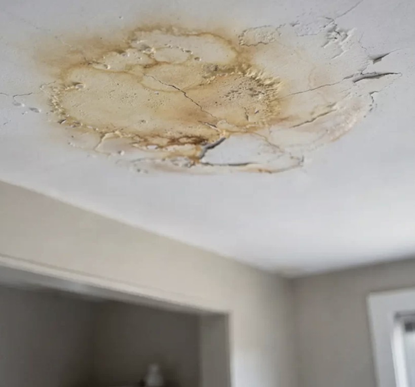 Interior ceiling damage before roof repair.