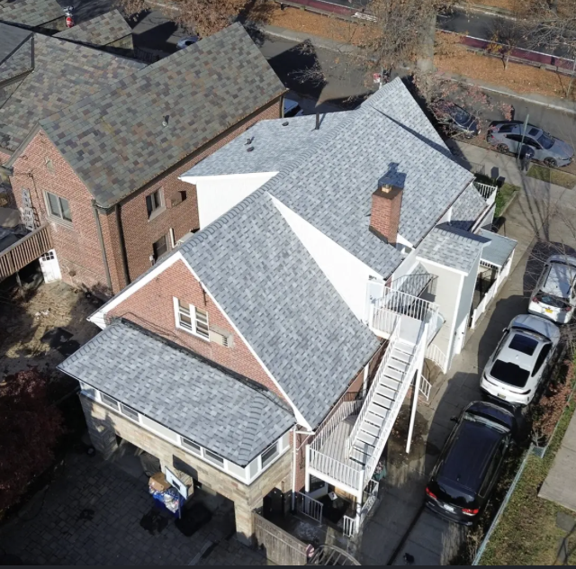 Roof shingles repair work by Captain Construction Corp.
